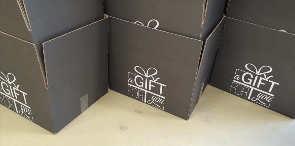 Kerstpakketten inpakken.png